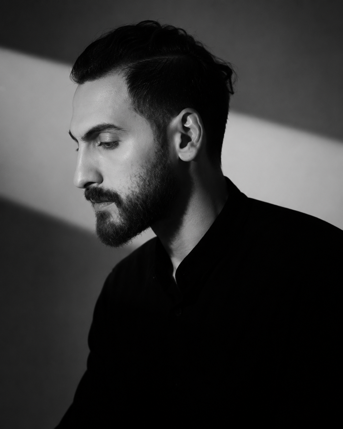 Black and white portrait of Wissam Barazi